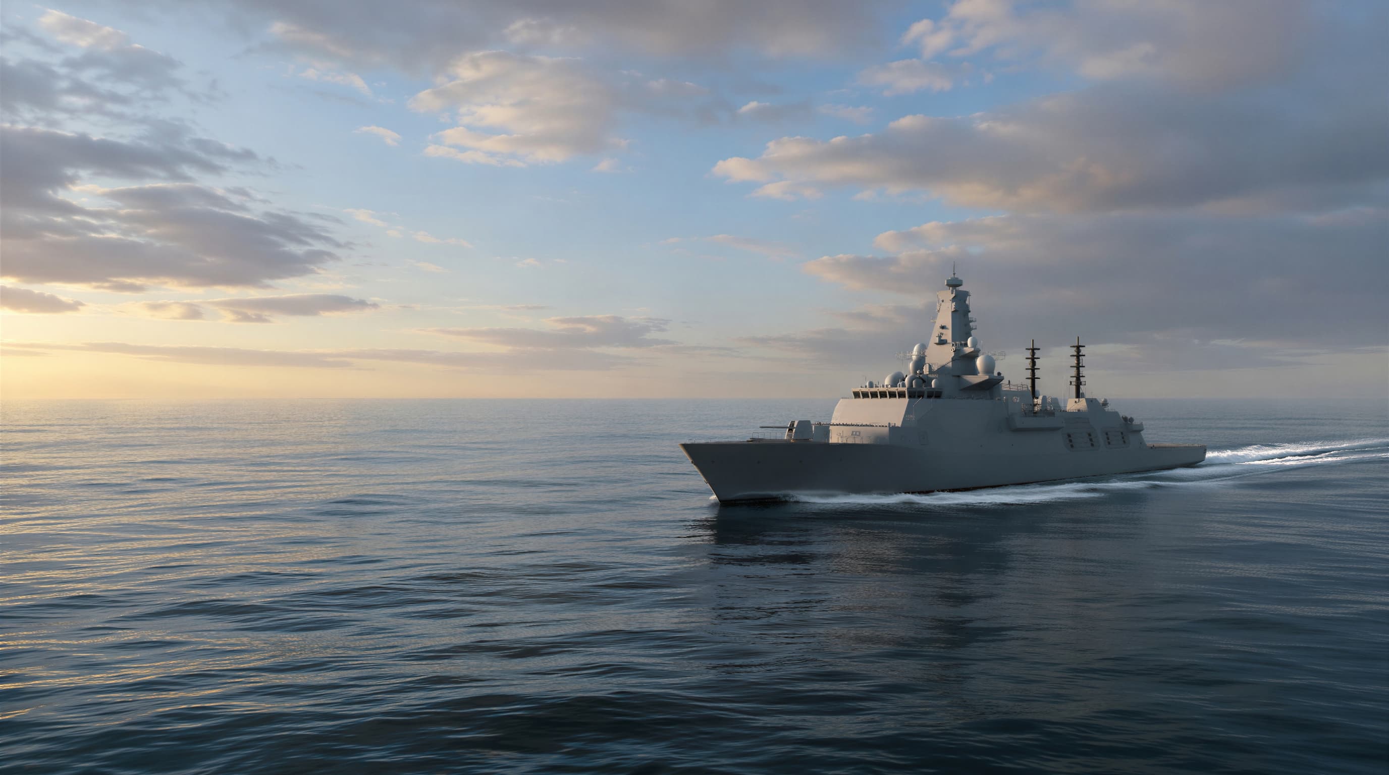 Naval frigate at sea during golden hour