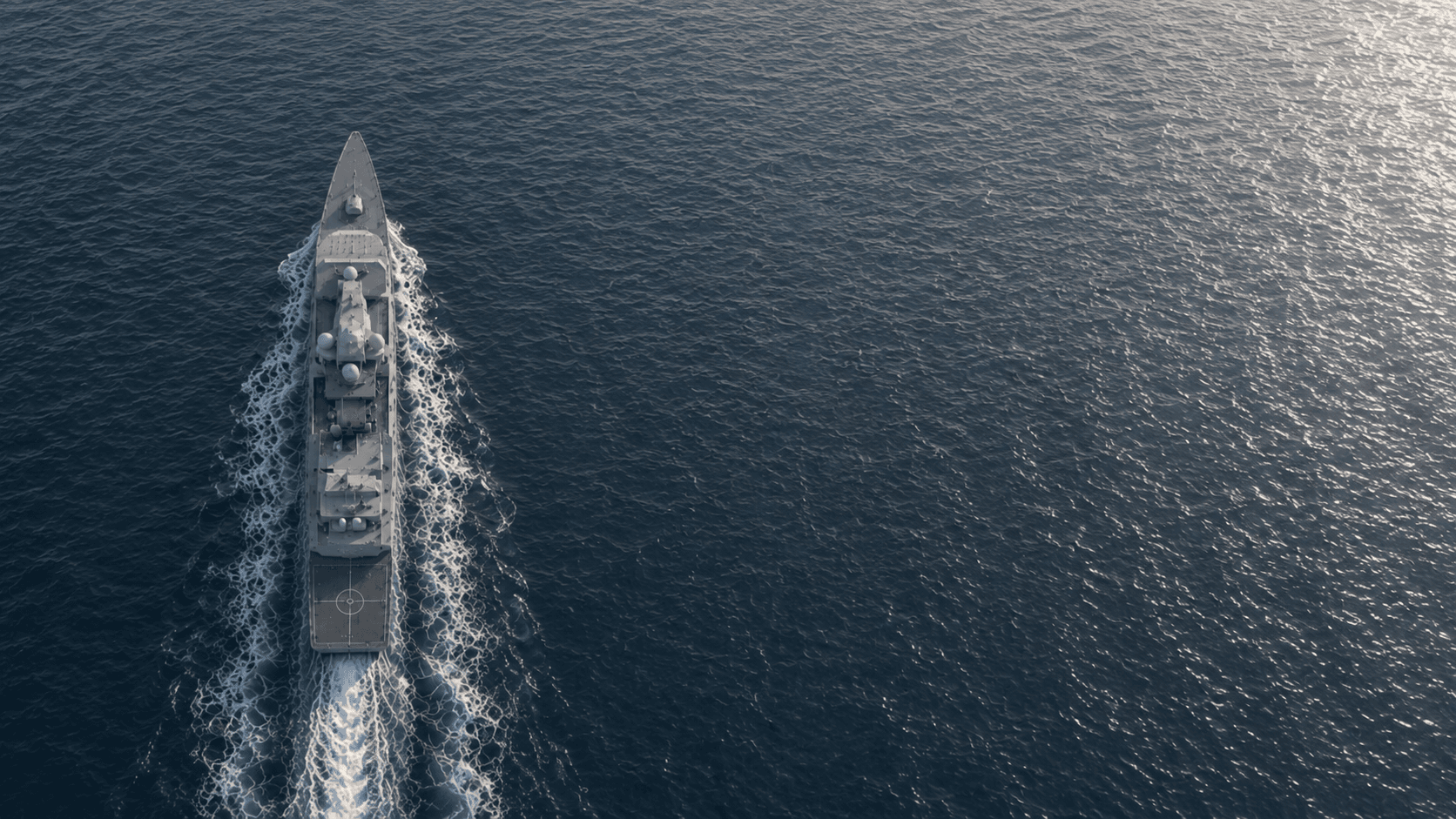 Vessel underway at dusk, viewed from above
